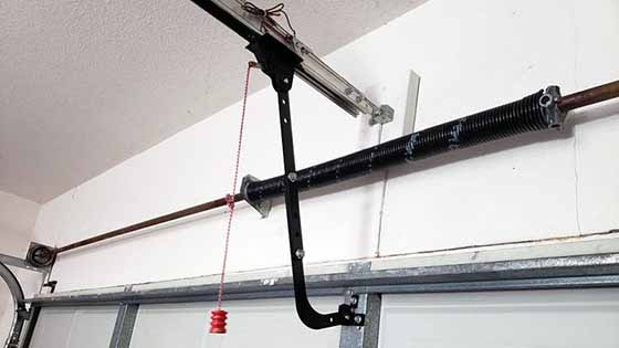 Overhead Door Houston Technician Repairing Garage Door Operator